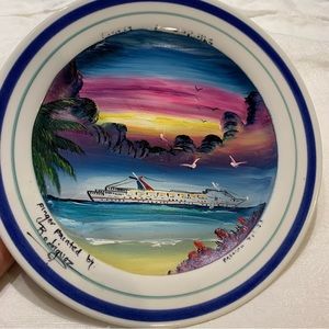 Decorative finger painted plate by Rodriquez.  8” in diameter.